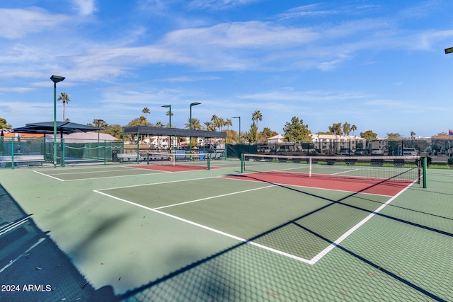 view of sport court with basketball hoop