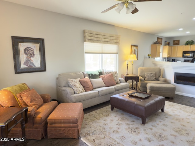 living area featuring recessed lighting, a ceiling fan, and wood finished floors