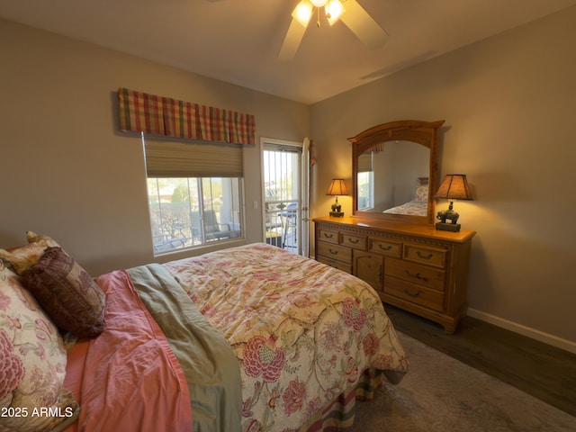 bedroom with baseboards, wood finished floors, a ceiling fan, and access to exterior