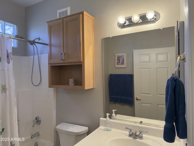 full bath featuring visible vents, toilet, vanity, and shower / bath combo