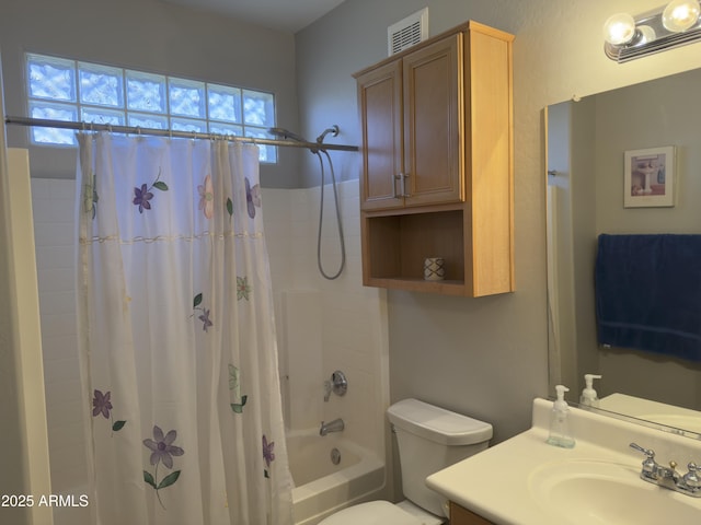 full bathroom featuring visible vents, toilet, shower / bath combo, and vanity