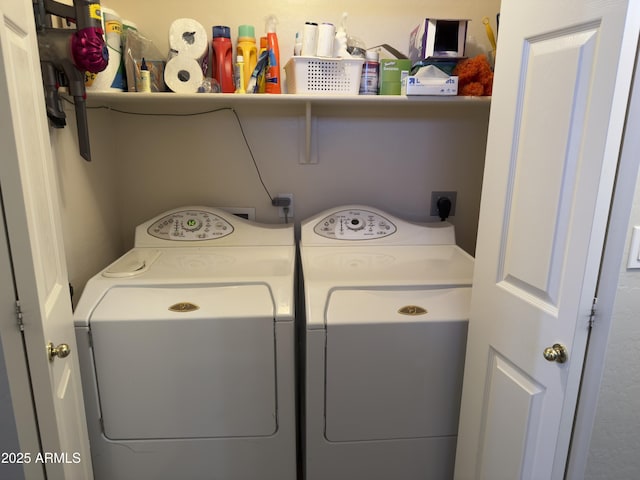 clothes washing area with washer and dryer and laundry area