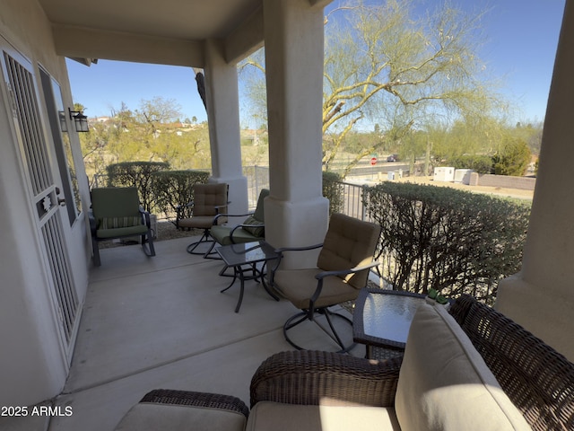 view of patio featuring a balcony