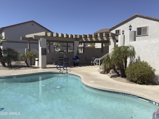 community pool with a patio, fence, and a pergola