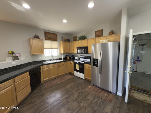 kitchen with a sink, dark wood-type flooring, black appliances, and light brown cabinetry