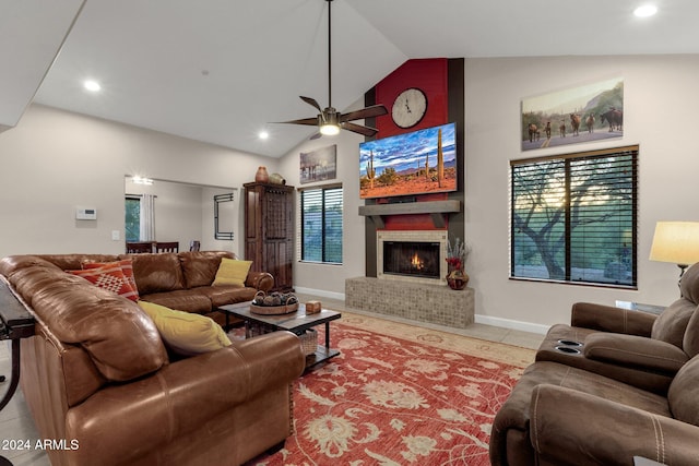 living room featuring ceiling fan, light tile patterned floors, and high vaulted ceiling