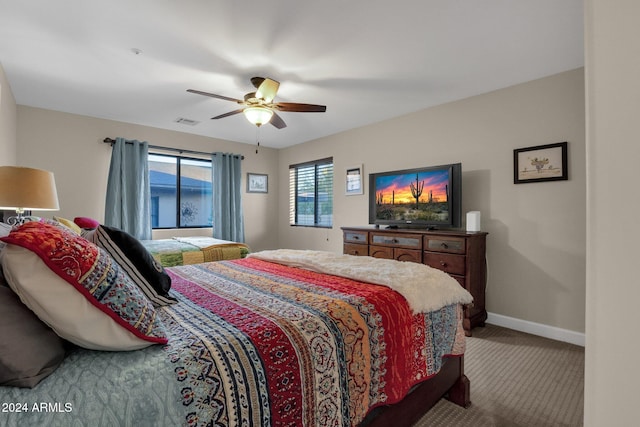 bedroom with ceiling fan and carpet floors