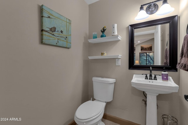 bathroom featuring toilet