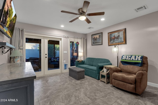 living room with ceiling fan and french doors