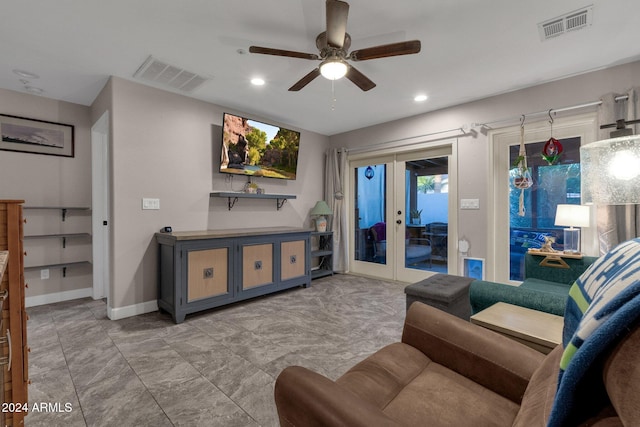 living room with ceiling fan and french doors