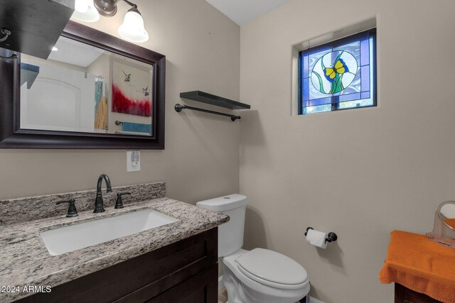 15019 N Mayflower Dr, Fountain Hills, AZ 85268 - half bath featuring toilet, vanity, and baseboards