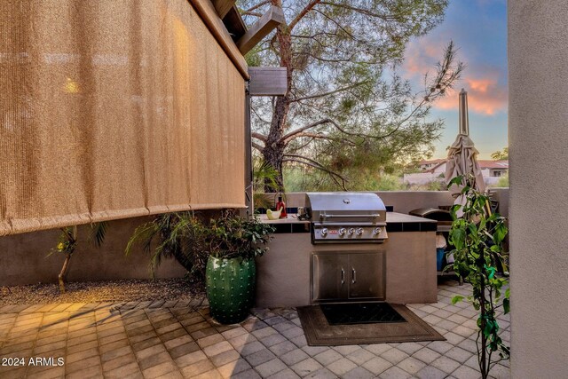 15019 N Mayflower Dr, Fountain Hills, AZ 85268 - patio terrace at dusk featuring a patio area