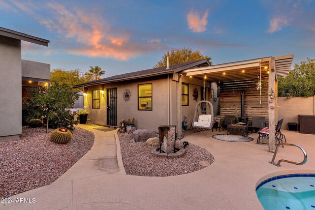 15019 N Mayflower Dr, Fountain Hills, AZ 85268 - back of property with a patio area, stucco siding, and an outdoor pool