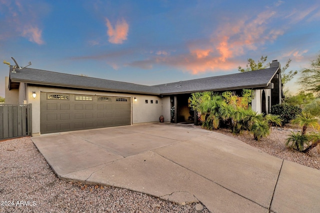 ranch-style home with a garage