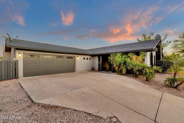 15019 N Mayflower Dr, Fountain Hills, AZ 85268 - single story home featuring driveway, an attached garage, stucco siding, and a chimney