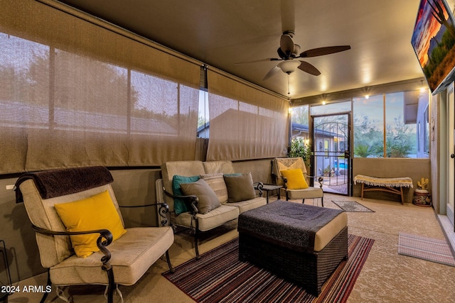 sunroom featuring ceiling fan