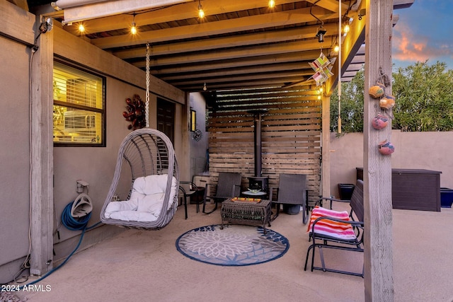 view of patio terrace at dusk