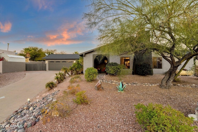 15019 N Mayflower Dr, Fountain Hills, AZ 85268 - view of front facade featuring concrete driveway, stucco siding, and a garage