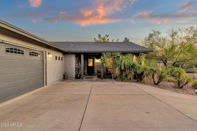 15019 N Mayflower Dr, Fountain Hills, AZ 85268 - ranch-style house featuring stucco siding, a garage, driveway, and a chimney