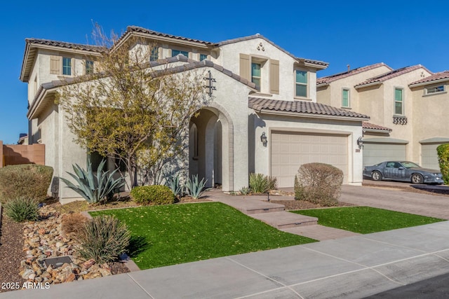 mediterranean / spanish-style house with a garage and a front yard