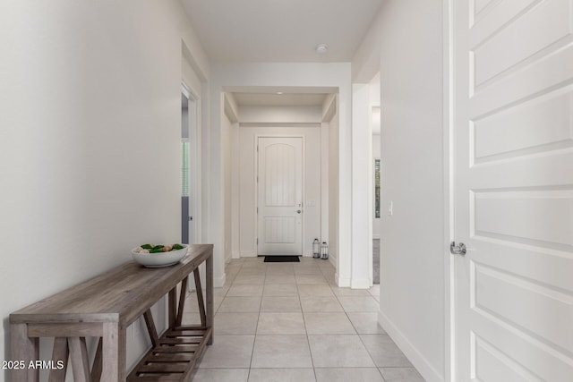 hallway with light tile patterned floors