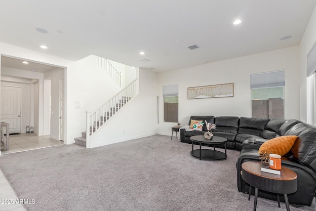 living room featuring light carpet