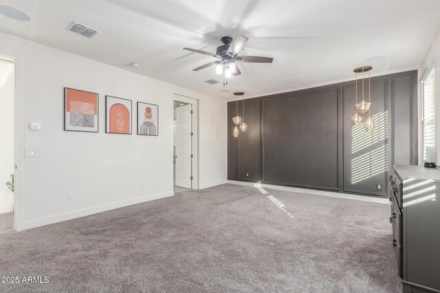 carpeted empty room with ceiling fan