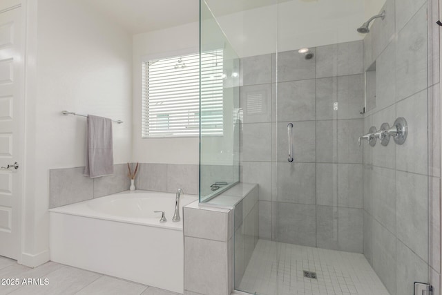 bathroom featuring tile patterned flooring and plus walk in shower