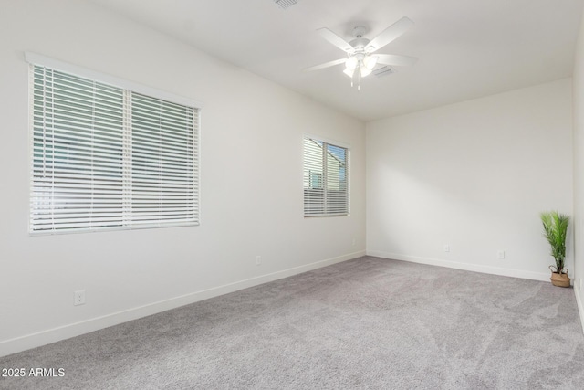 unfurnished room with ceiling fan and carpet floors