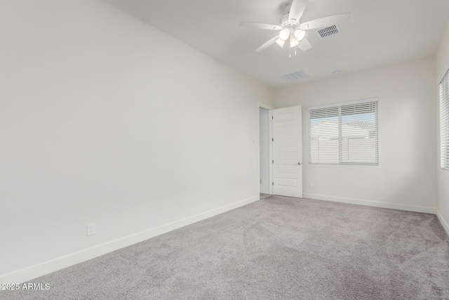 unfurnished room with ceiling fan and carpet flooring