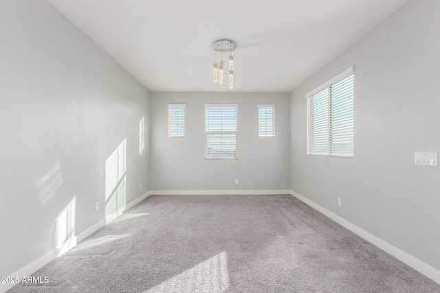 unfurnished room featuring carpet