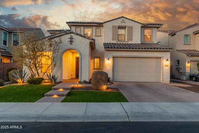 mediterranean / spanish-style house featuring a garage