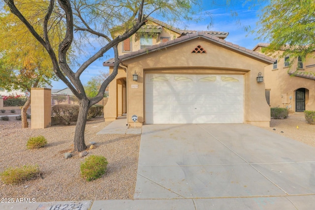 mediterranean / spanish-style house featuring a garage