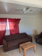 living room featuring ceiling fan