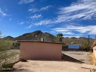 view of side of home featuring a mountain view