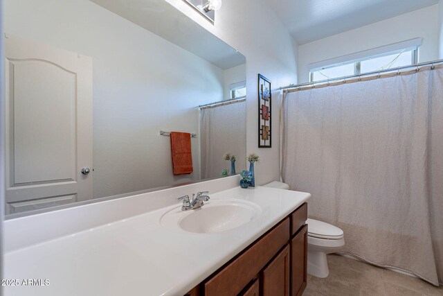 full bath with toilet, tile patterned floors, vanity, and a shower with shower curtain
