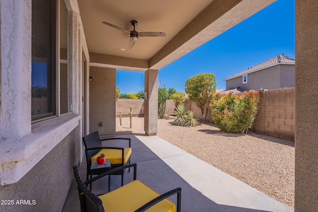 view of patio / terrace with a ceiling fan and a fenced backyard