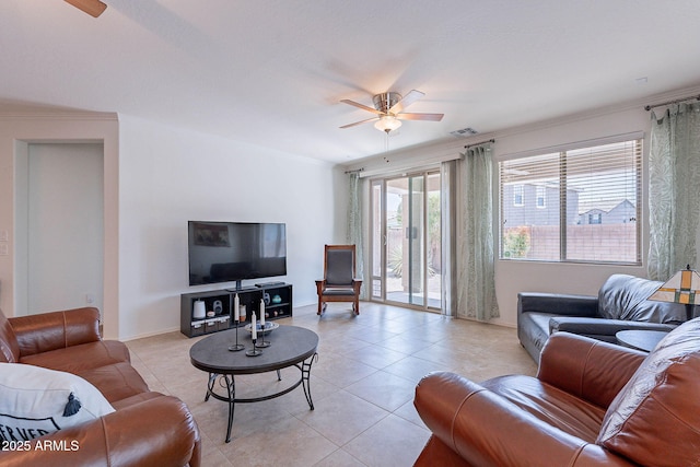 living area with light tile patterned floors, ceiling fan, crown molding, and visible vents