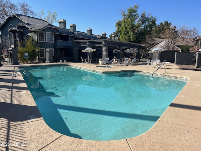 view of swimming pool with a patio area