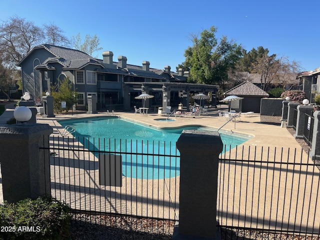 view of swimming pool featuring a patio area