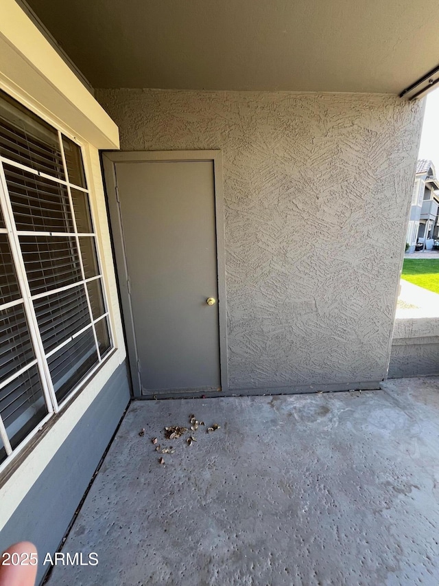 entrance to property featuring a patio