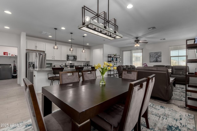 dining room featuring ceiling fan and light hardwood / wood-style floors