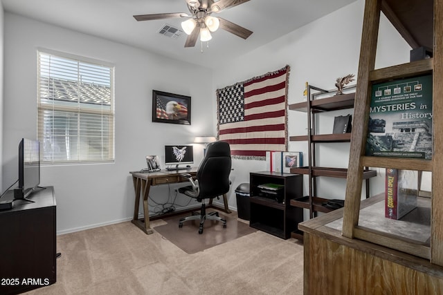 office with light colored carpet and ceiling fan