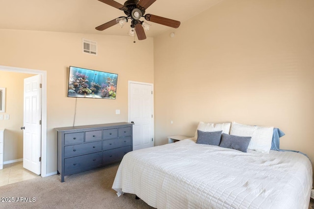 carpeted bedroom with high vaulted ceiling, baseboards, ceiling fan, and visible vents