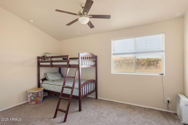 carpeted bedroom featuring baseboards and ceiling fan