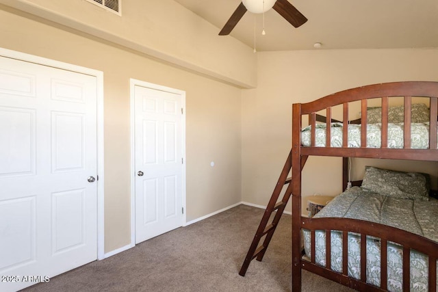 bedroom with baseboards, visible vents, ceiling fan, and carpet flooring