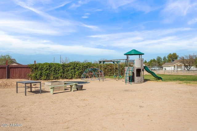 community jungle gym featuring fence