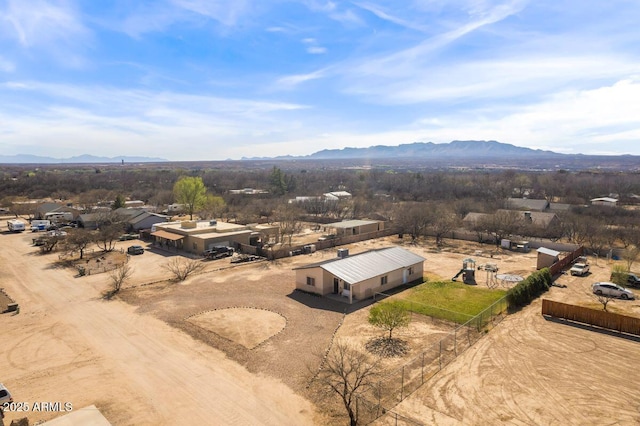 birds eye view of property with a mountain view