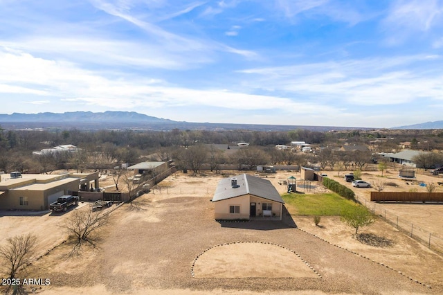 birds eye view of property featuring a mountain view