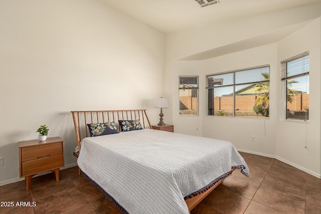 bedroom featuring visible vents and baseboards